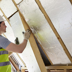 Man installing roof insulation