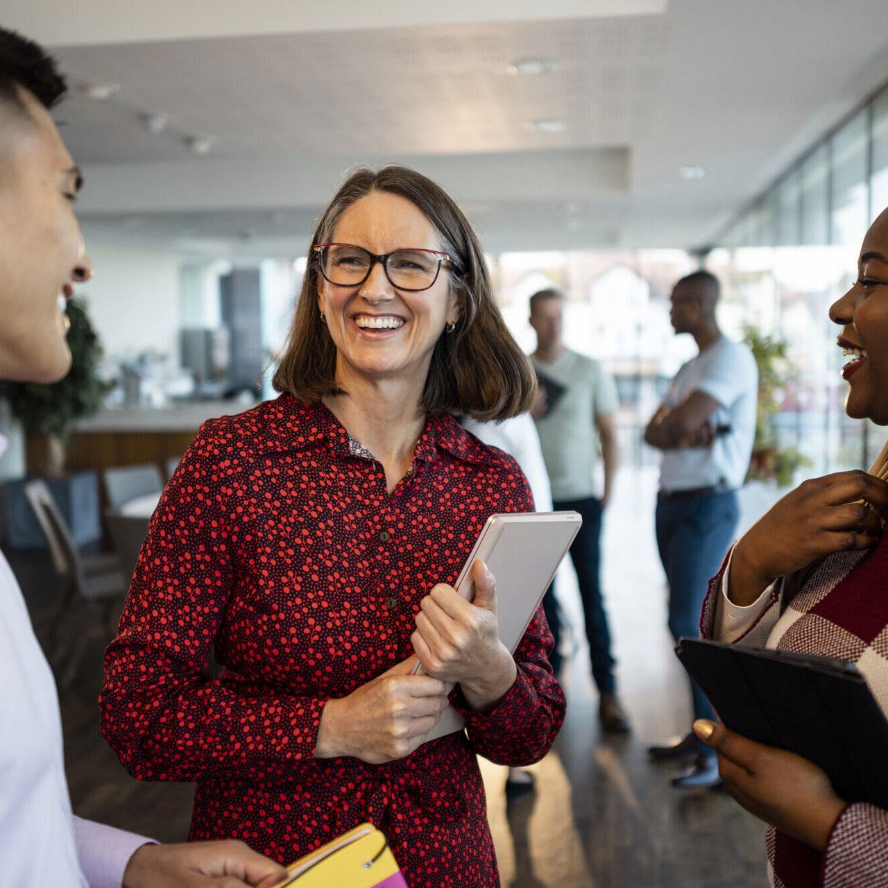 Business professionals networking and smiling