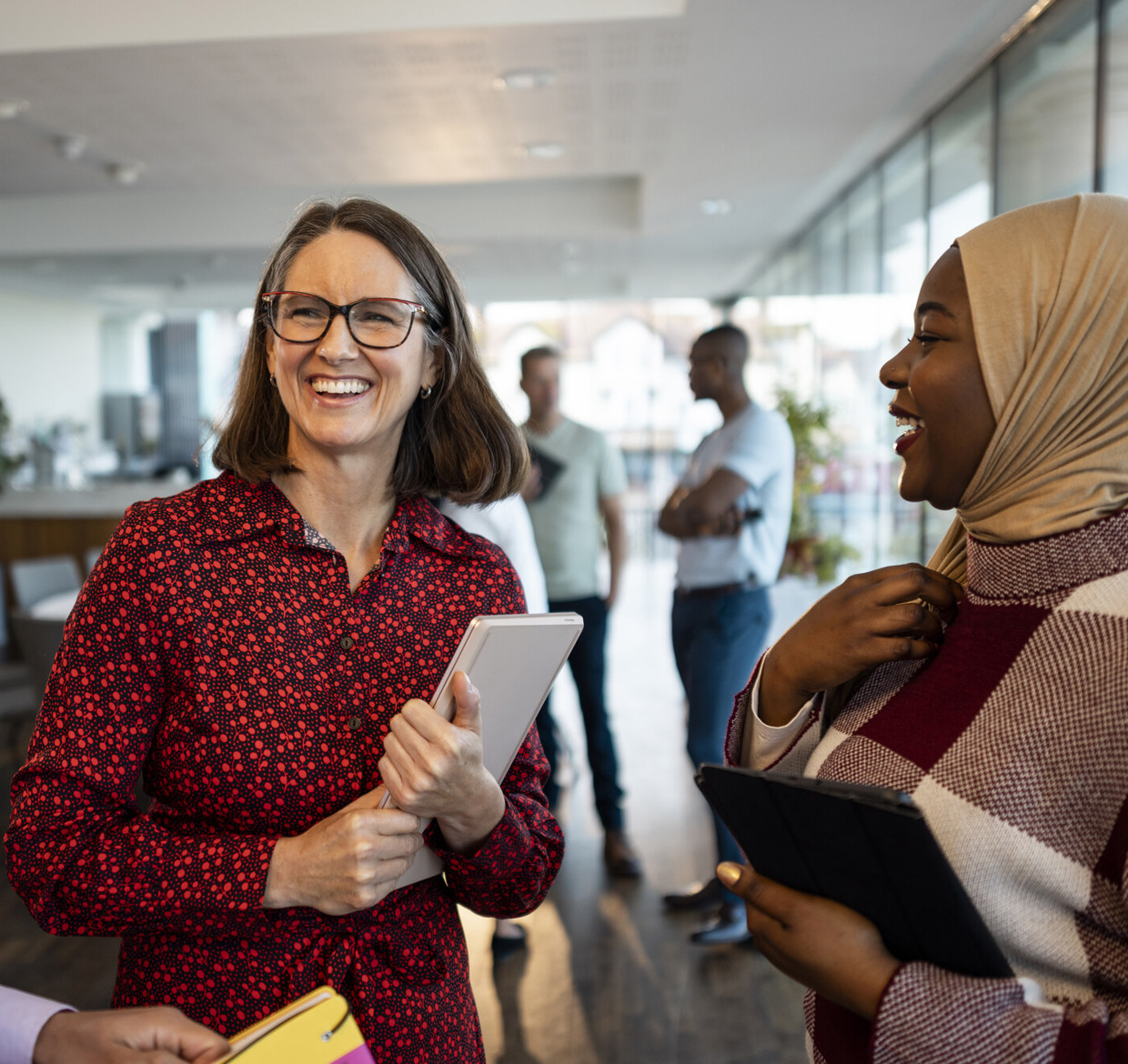 group of people talking and smiling