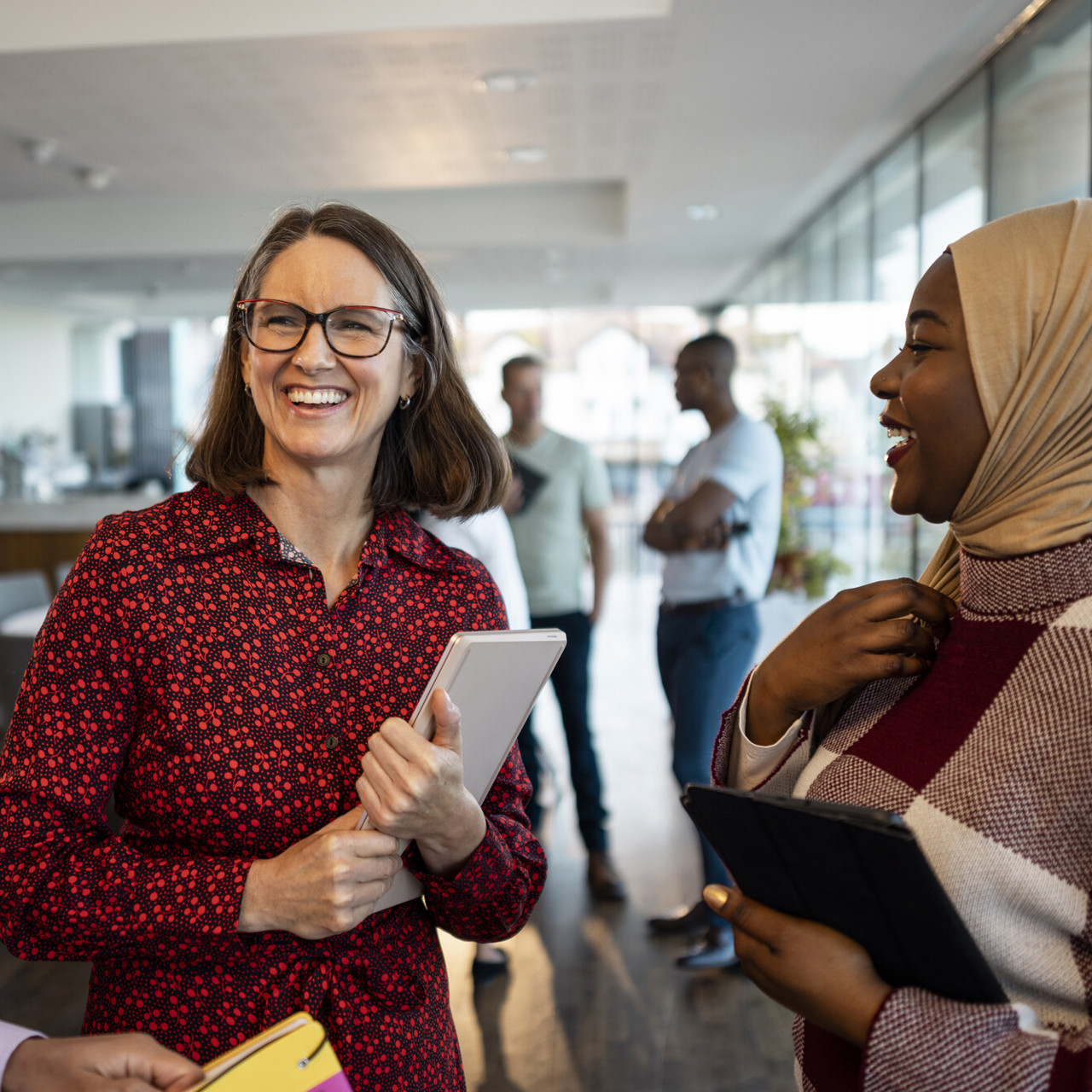 group of people talking and smiling