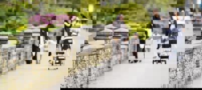 Women And Children Walking Down Street