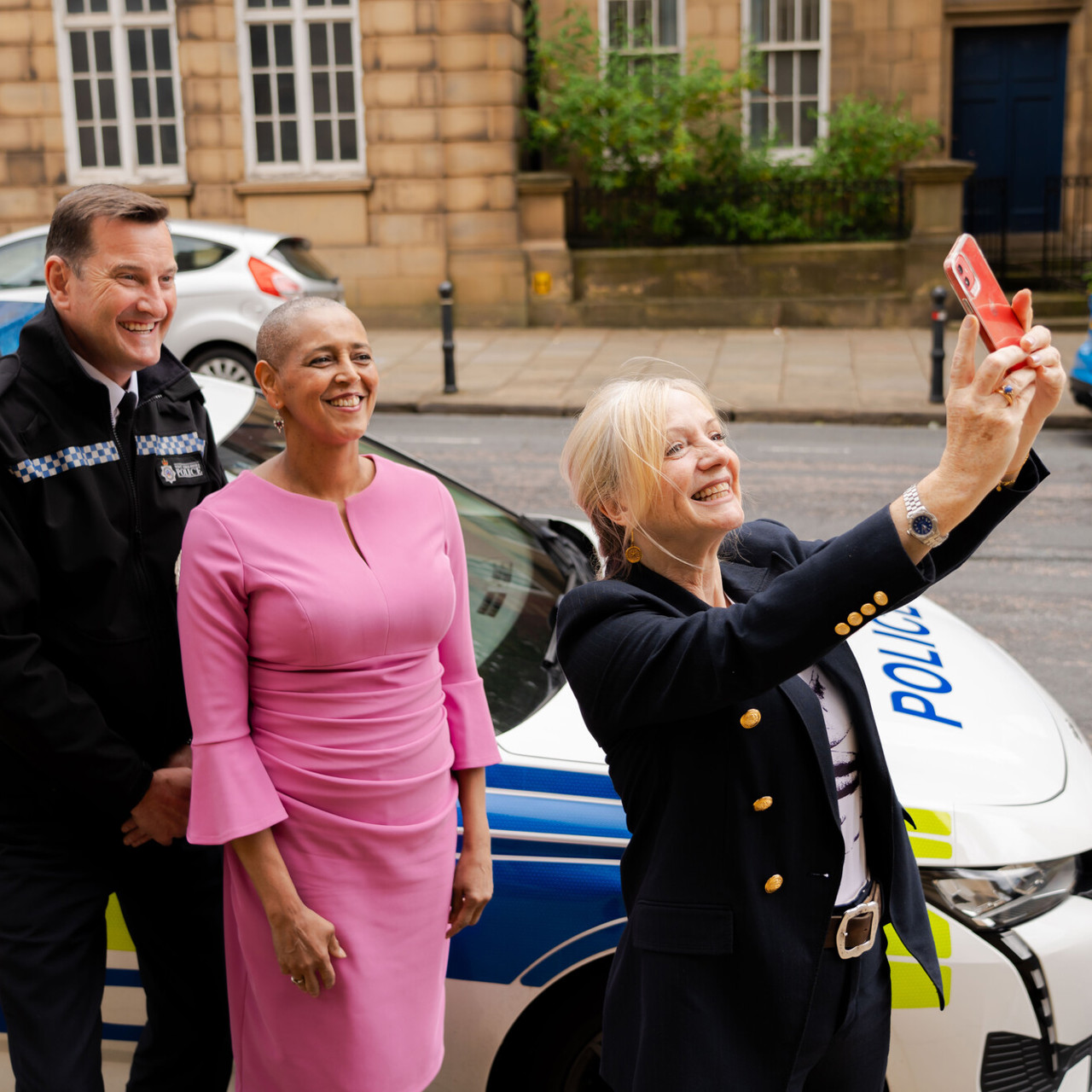 The Mayor of West Yorkshire taking a selfie with the Deputy Mayor and a police man