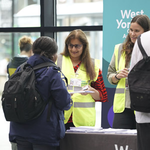 Combined Authority Colleagues Speaking With The Public At The Mayor's Big Bus Chat In Leeds Train Station