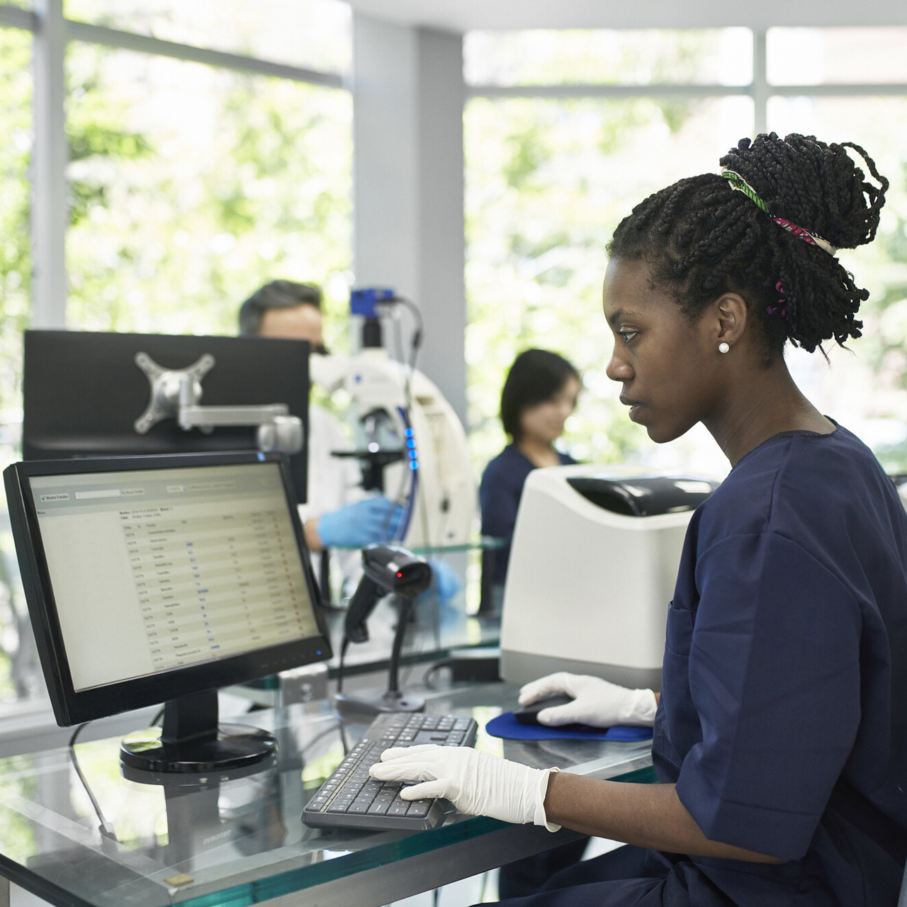 Female Health Worker Using Computer