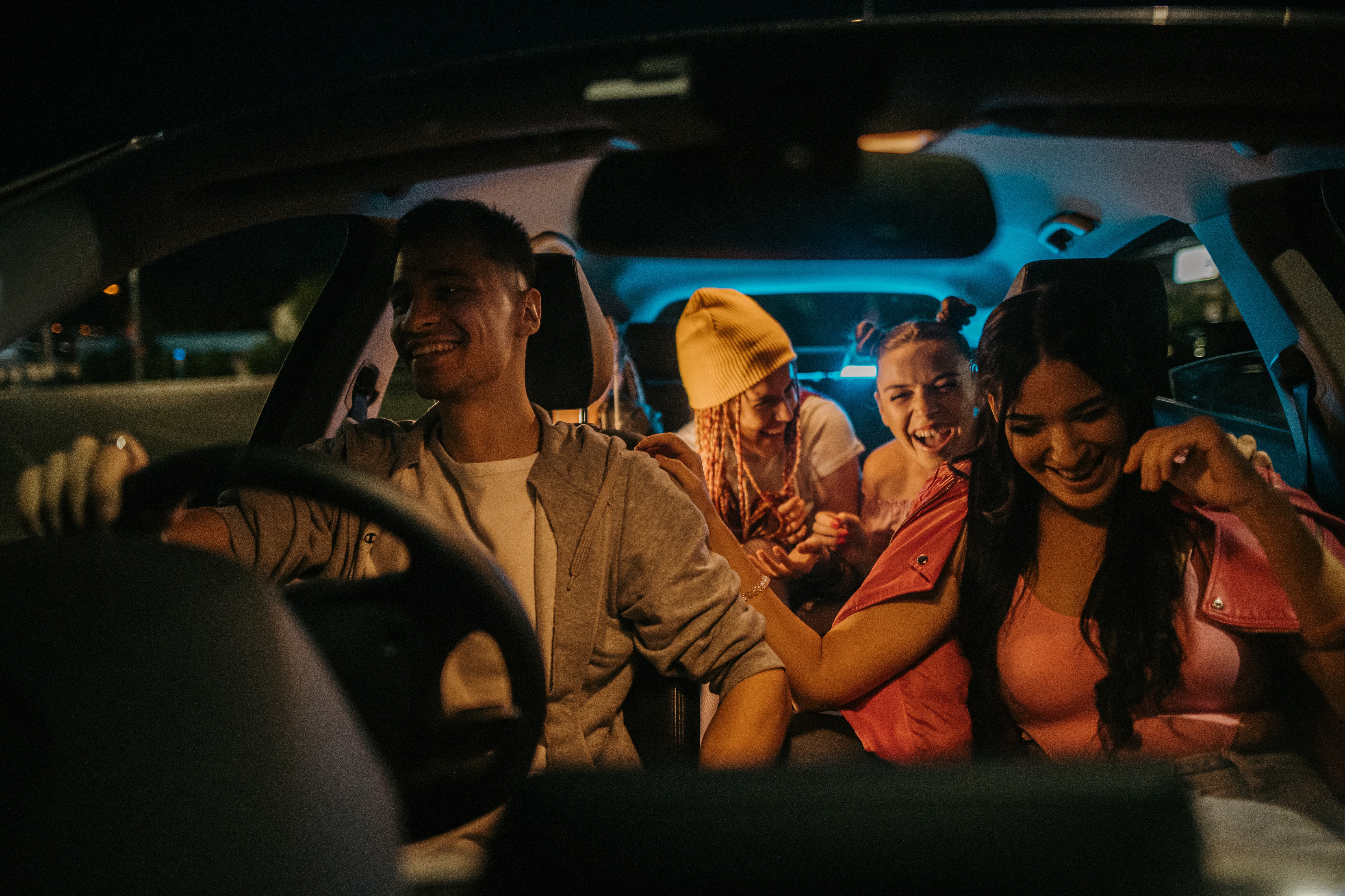 Young people driving in a car