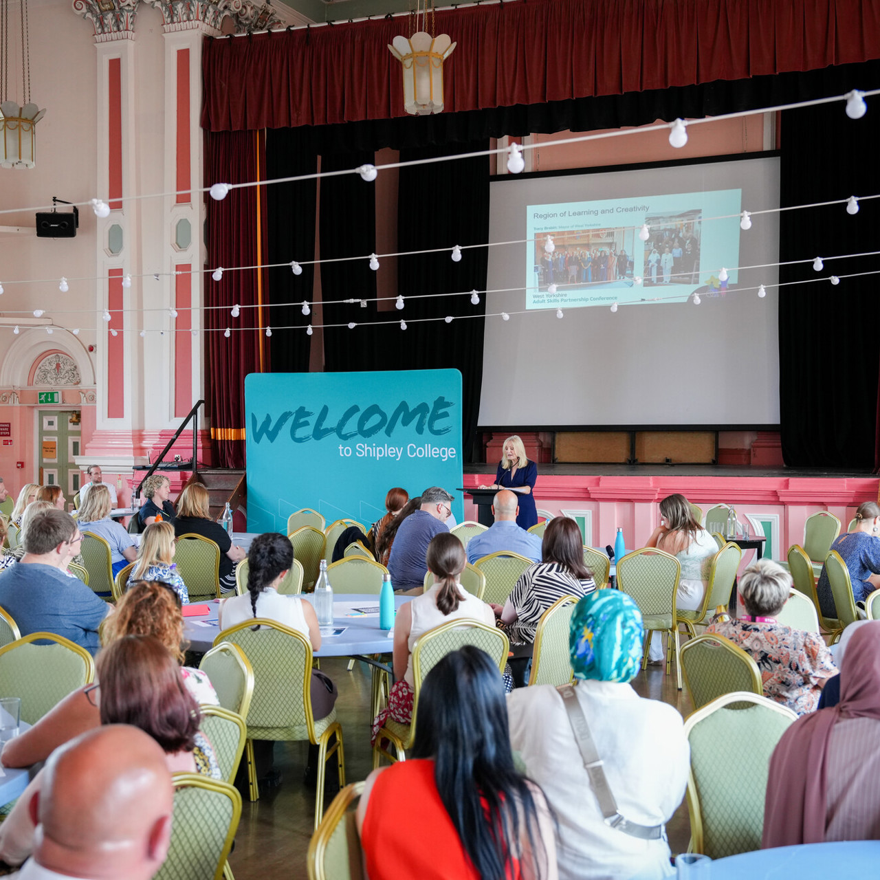 Delegates at tables for college event