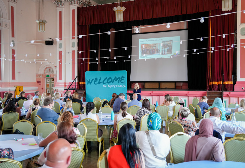 Delegates at tables for college event
