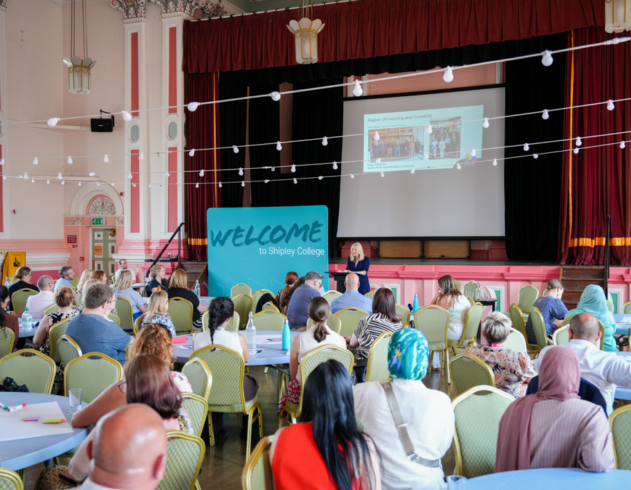 Delegates at tables for college event