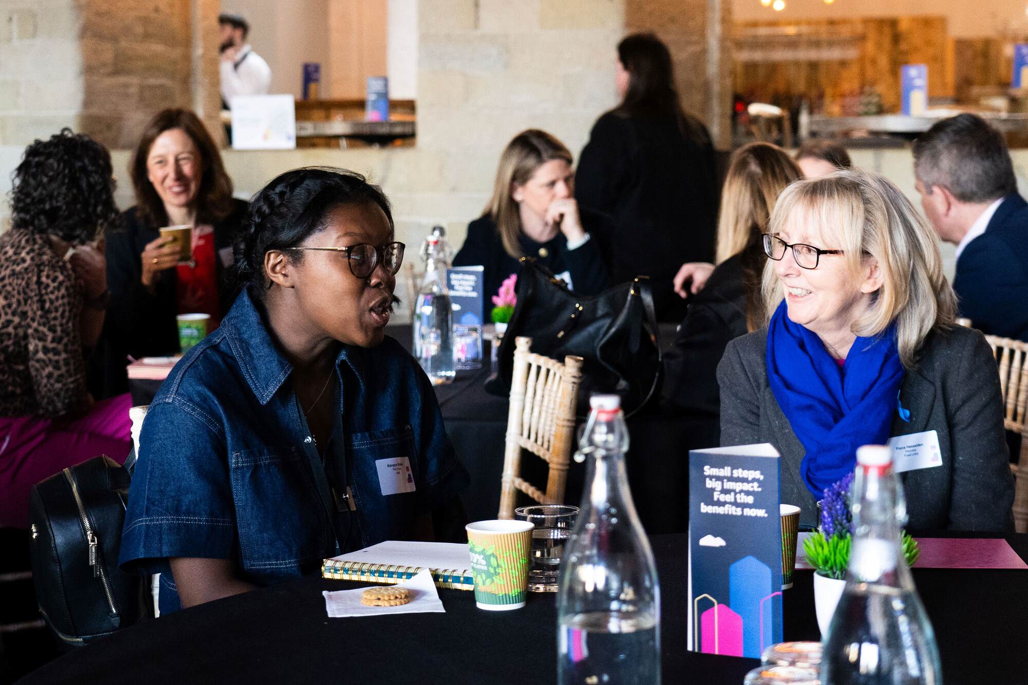 Two Women Talking At The Fair Work Charter Event 2025