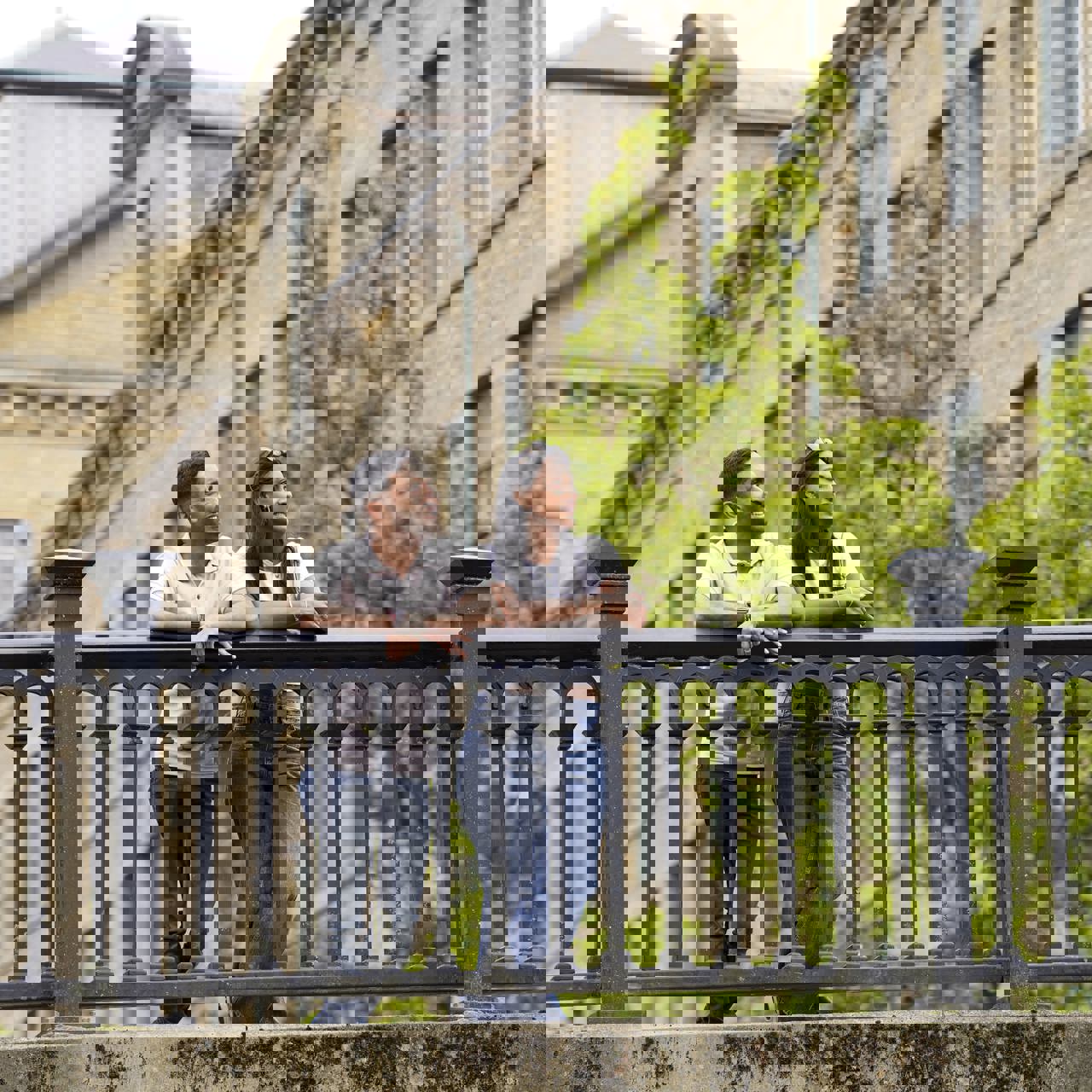 Couple standing on a bridge in Saltaire