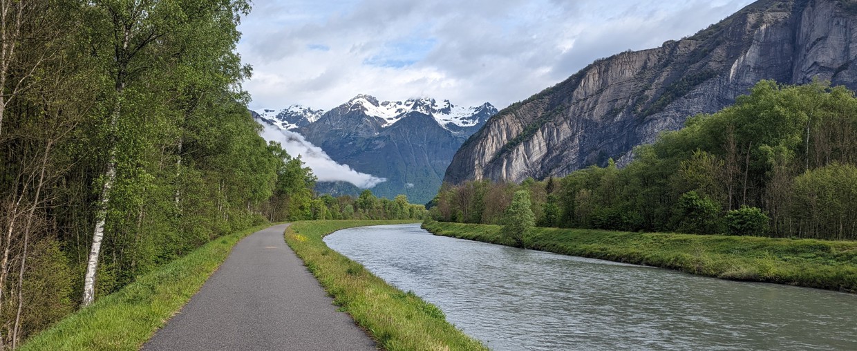 A road alongside a mountain lake