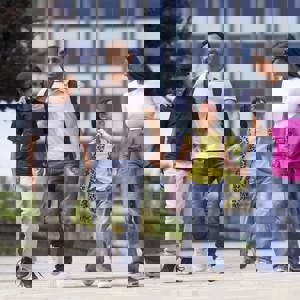 A family holding hands in Bradford