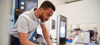 Man working on a laptop in a lab