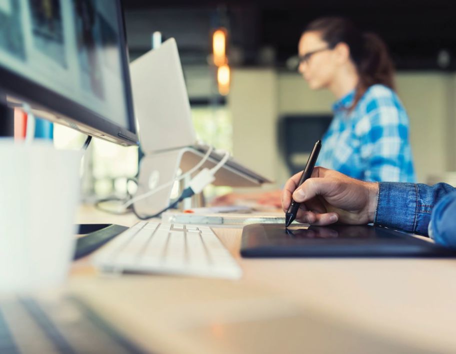 Computer and keyboard on a desk