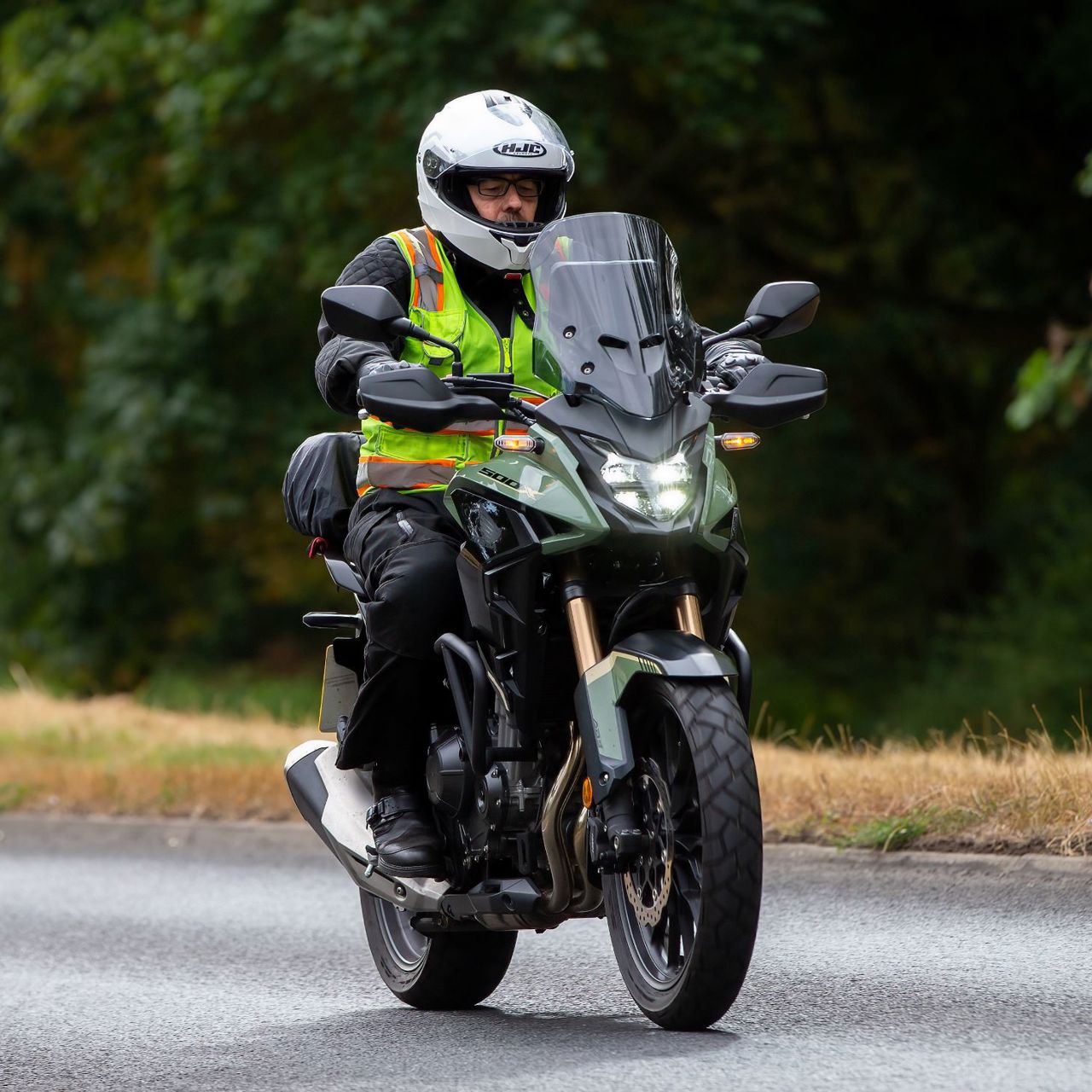 Motorcyclist wearing a hi-viz vest