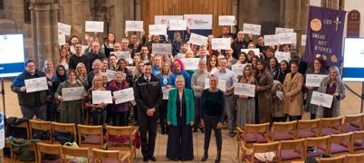A group photo of Tracy Brabin, Alison Lowe and Chief Constable John Robins with recipients of the Mayor's Safer Communities Fund