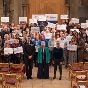 A group photo of Tracy Brabin, Alison Lowe and Chief Constable John Robins with recipients of the Mayor's Safer Communities Fund